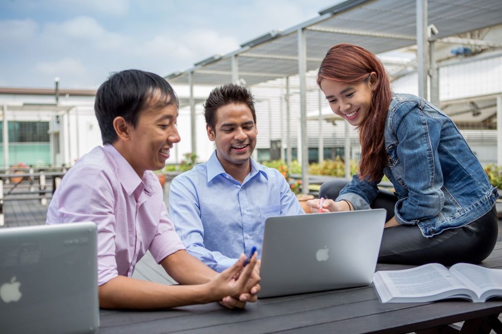 Miniature of Students engaged in discussion at a roof top garden