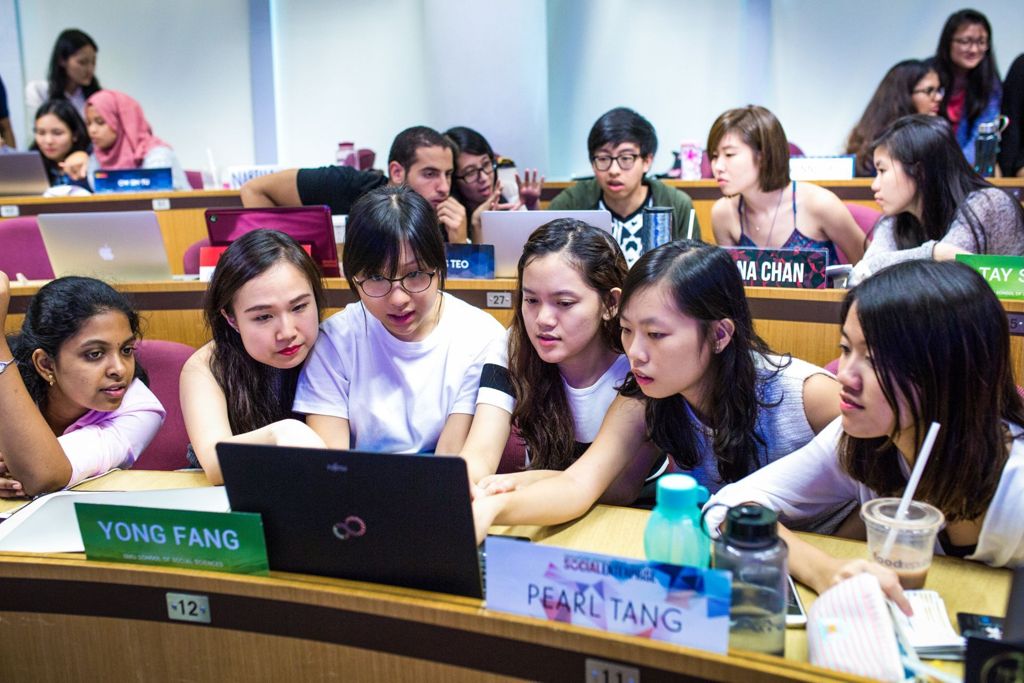 Miniature of Students in active group discussions in a seminar room as part of their learning