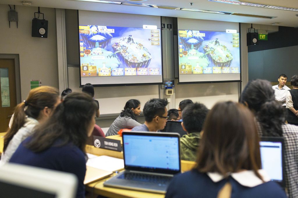 Miniature of Students learning business concepts via a game in a lecture