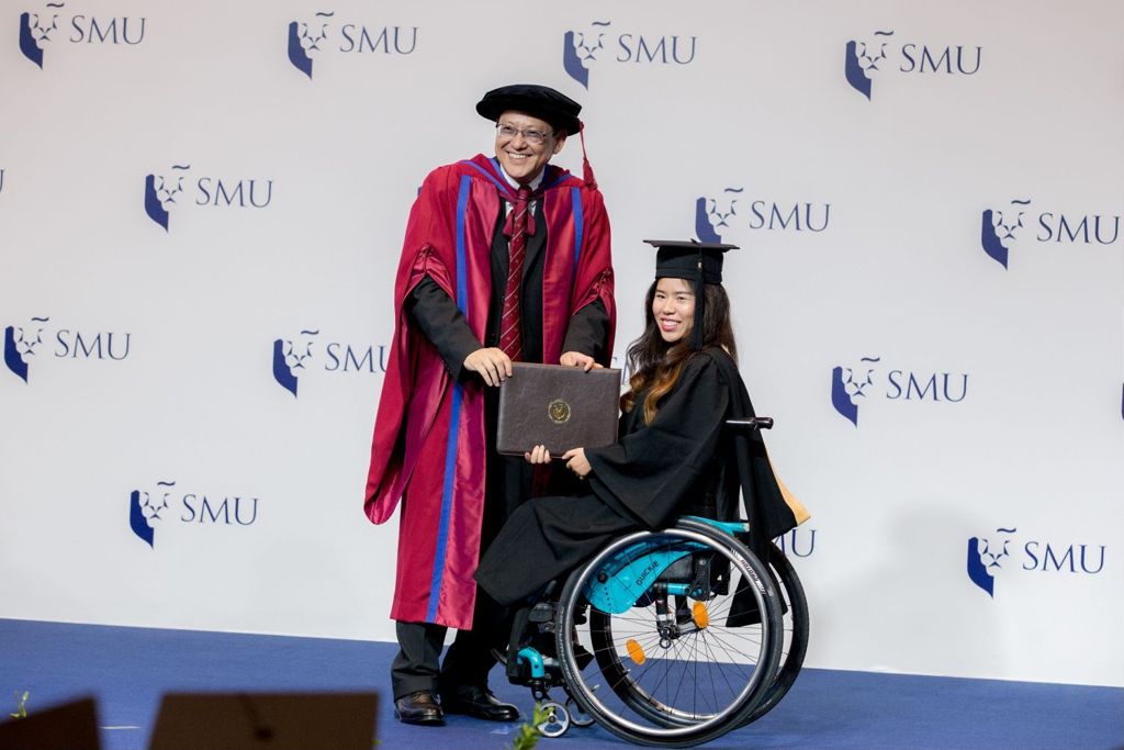 Miniature of Singapore national para-swimmer Yip Pin Xiu receiving her graduation certificate from Professor Yeo Tiong Min in the 2017 commencement